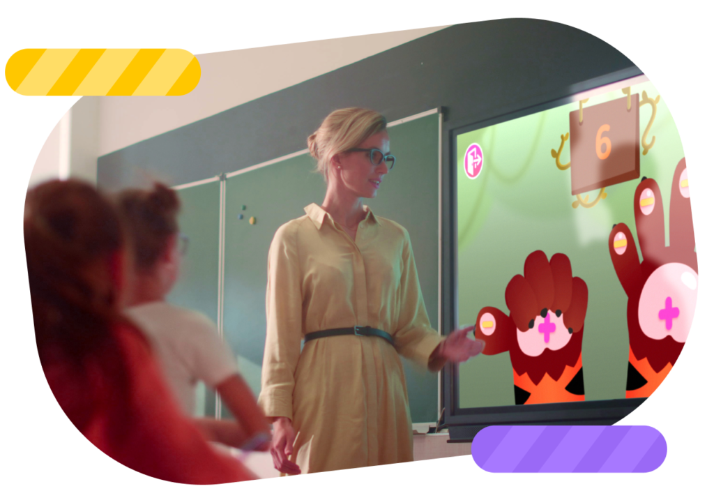 Teacher in the classroom using Smart Tales on an interactive display.